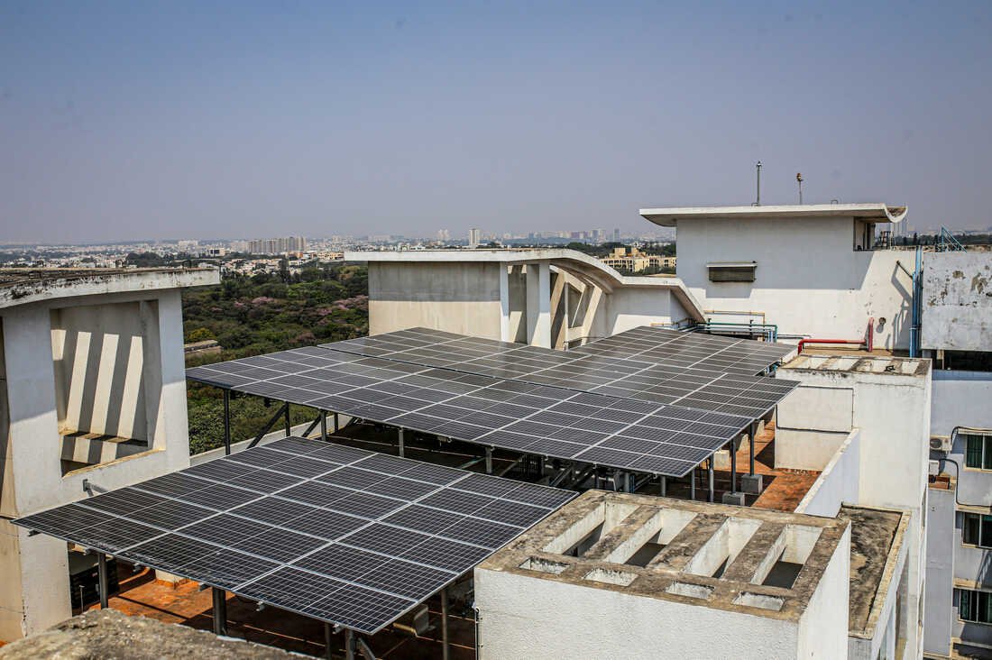 Solar panels on the roof of an apartment block in Bengaluru, India, on Monday, Feb. 21, 2022. Solar power, which has become the cheapest source of new power, is growing fast. India aims to install 175 gigawatts of renewable energy, three times the amount currently deployed in the U.K., in 2022. Photographer: Dhiraj Singh/Bloomberg via Getty Images